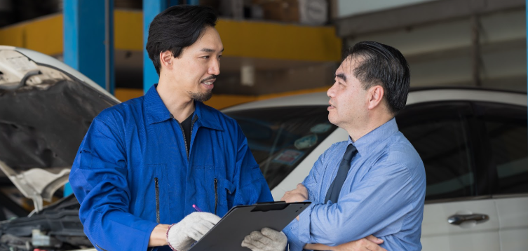 mechanic talking to customer
