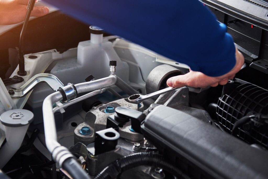 man fixing a car