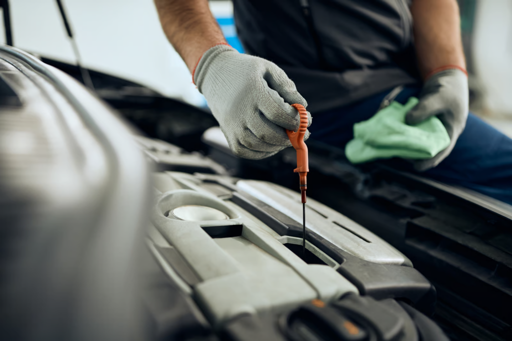 Mechanic Checking Dipstick