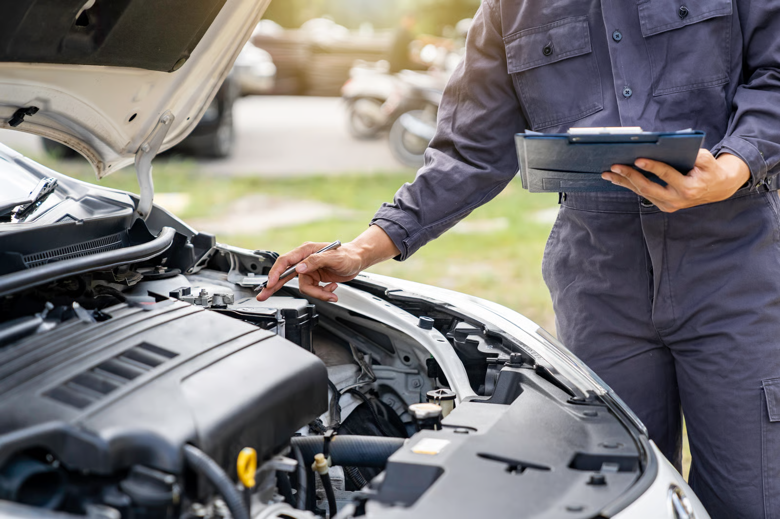 Mechanic inspecting engine bay